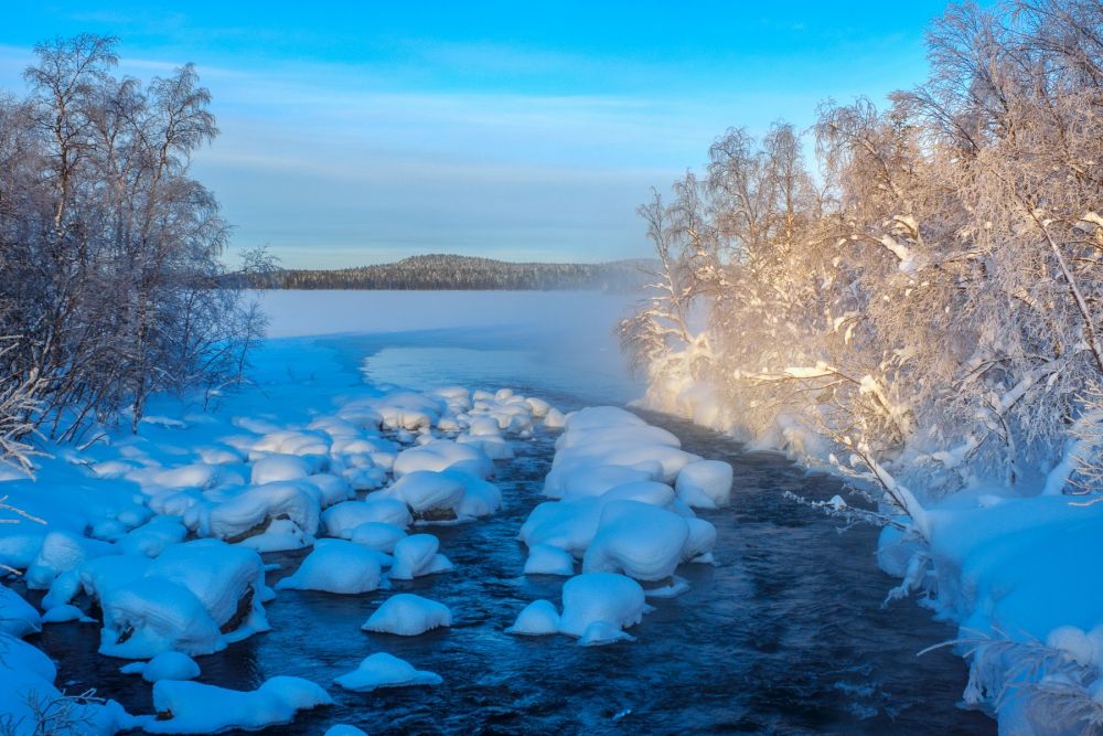 Lac en Laponie lors d'un voyage Photo aurores boréales